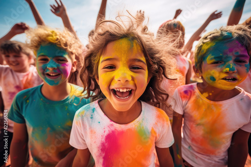 Group of happy color painted kids in color run event, cheerful expressions