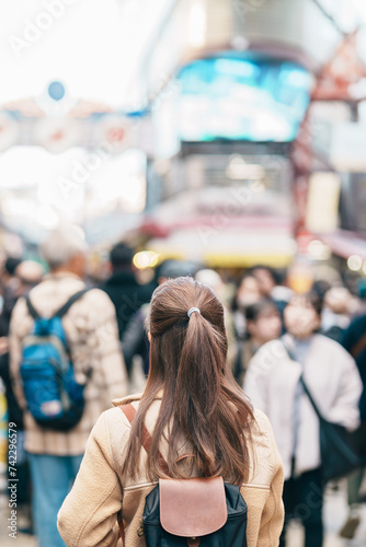 Photography Tourist woman visit Ameyoko market, a busy market street located in Ueno