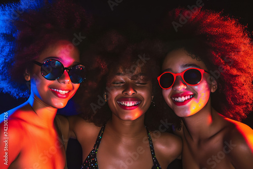 Studio Image of Teen Girls in Bikinis, Afro, and Sunglasses  © Creative Valley
