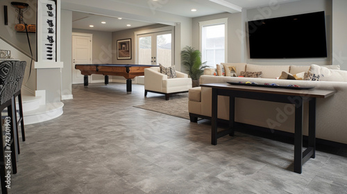 Transform your bat into a functional and inviting space with the help of our flooring spets. This picture shows a bat recreation room with a durable and trendy vinyl flooring