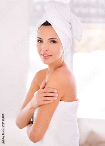 Happy woman, portrait and skincare with towel for hygiene, beauty or spa treatment at home. Female person or model touching shoulder in satisfaction for perfect skin in dermatology or cosmetology