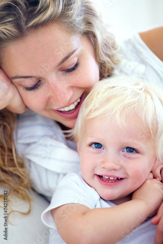 Portrait, mom and baby bonding in home with smile, support and quality time with happy family wellness. Relax, mother and face of toddler son with love, growth and child development in apartment.