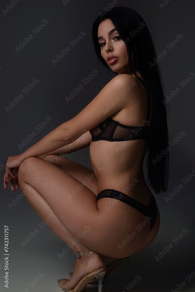 Fototapeta premium Sexy woman face. Sensual young woman posing with sexy slim body. Beautiful sexy model. Beauty female face. Sensual girl, sexy model portrait. Natural beauty.