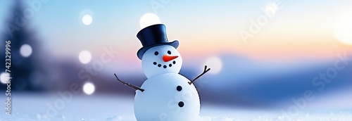 Christmas winter background with snowman in snow and blurred bokeh background.Merry Christmas and happy new year greeting card with copy space. © Kseniya Ananko