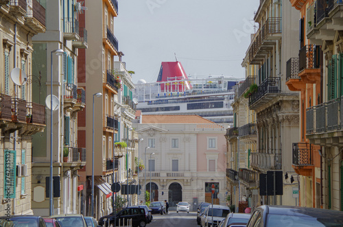 Scenic panoramic view of historic old town downtown with historic building facades, parks, the church and cruise destination Messina, Italy close to Taormina on Sicily photo