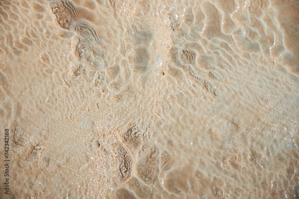 Natural texture. Narzan mineral spring. Yellow mineral structure on the surface of the earth. The healing waters of the planet Natural texture. Narzan mineral spring. Yellow mineral structure on the surface of the earth. The healing waters of the planet