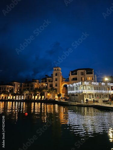 Night embankment of the resort town by the sea