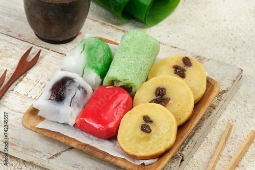 Kue Basah or Jajan Pasar,Various Indonesian Traditional Snack Served on wooden plate photo