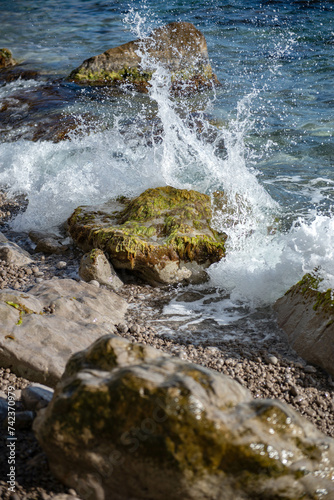 The waves of the sea break on the coastal rocks