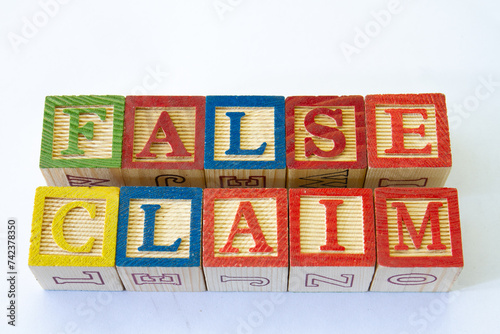 The term false claim visually displayed on a clear background with copy space in horizontal format photo