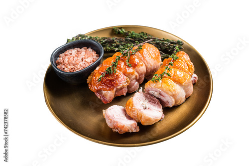 Roasted Stuffed chicken roll with cheese and ham on a steel plate.  Isolated, Transparent background.