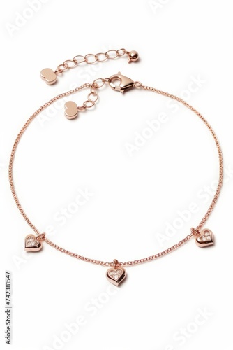 A bracelet featuring heart charms in rose gold color, placed on a plain white background. The heart charms are intricately designed and add a touch of elegance to the accessory
