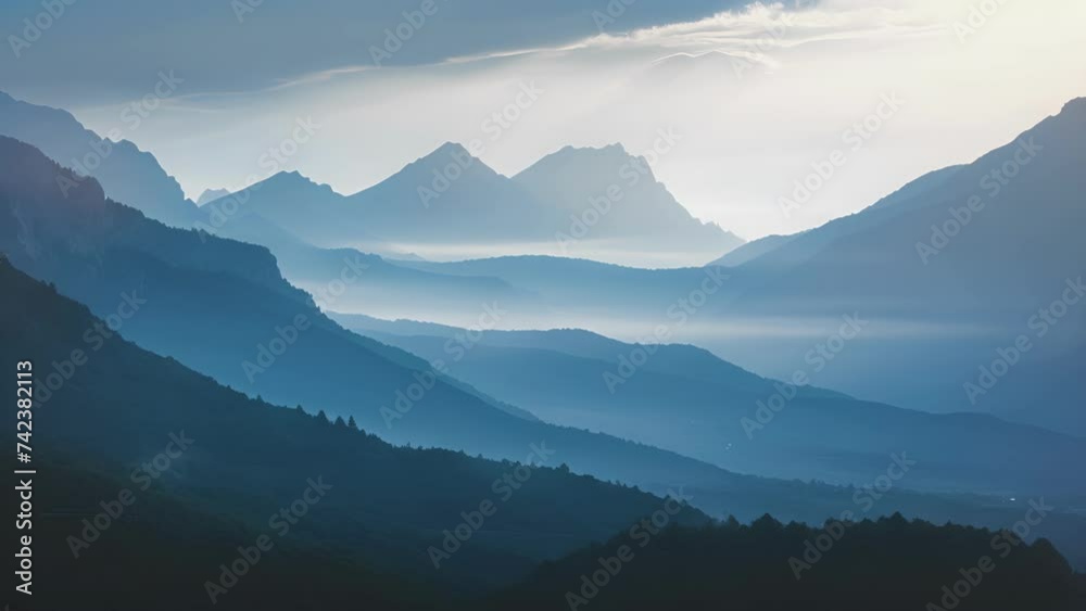 The fading light creating an ethereal aura around the mountain silhouettes. The fading light creating an ethereal aura around the mountain silhouettes.