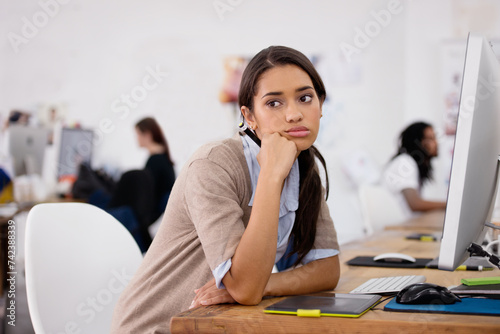 Tired, woman and bored in coworking space with computer for planning, schedule and ideas for job. Businesswoman, thinking and technology in office with depression, exhausted or burnout at desk