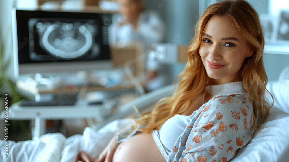 A pregnant woman in a hospital bed with the background a computer screen of an Ultrasound Sonogram Procedure to a Pregnant Woman. future Mother