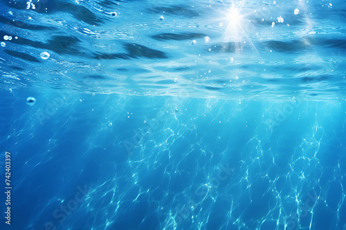 Clear blue water surface with beautiful splashing ripples and soap bubbles. Abstract summer banner background © Surasak