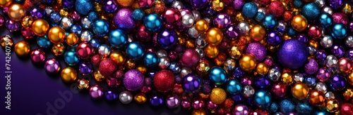 mardi gras beads on a purple background