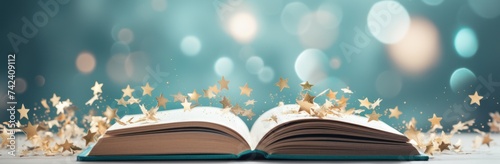 confetti and graduation cap on top of an open book