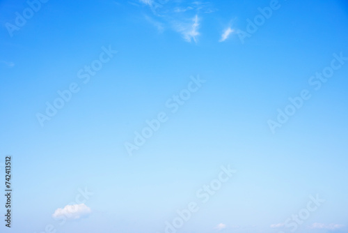 Obraz na płótnie Blue sky background and white clouds soft focus, and copy space horizontal shape. w salonie