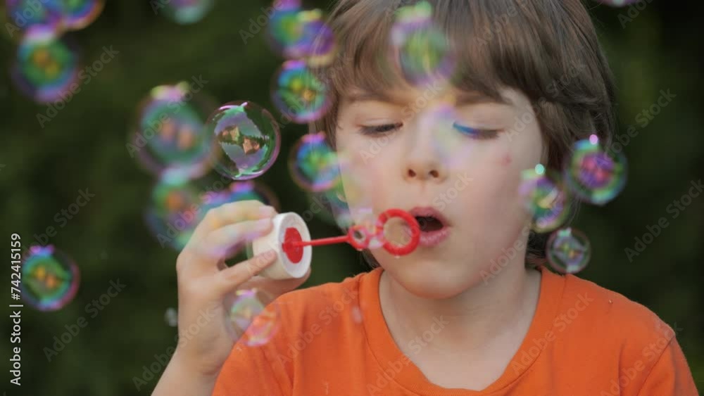 Little Boy Blowing Soap Bubbles Having Fun Playing Outside, Child Innocence and Curiosity. Boy Kid Blowing Soap Bubbles in Park, Garden and Nature, Having Fun, Joy and Childhood Development, Freedom. Little Boy Blowing Soap Bubbles Having Fun Playing Outside, Child Innocence and Curiosity. Boy Kid Blowing Soap Bubbles in Park, Garden and Nature, Having Fun, Joy and Childhood Development, Freedom.