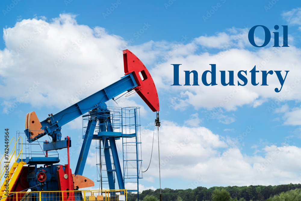 Oil industry. Oil rigs. oil pumps on a background of blue sky with clouds. Copy space. Oil industry. Oil rigs. oil pumps on a background of blue sky with clouds. Copy space.