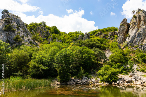 Red rock, cliff in the Gurzuf valley on the southern coast of the Crimea peninsula, located at an altitude of 430 meters above sea level. photo