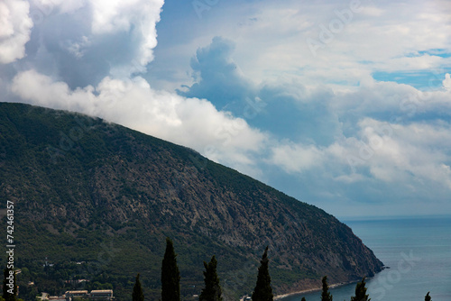 Mount Ayu Dag with clouds on the background of the Black Sea in the early morning.