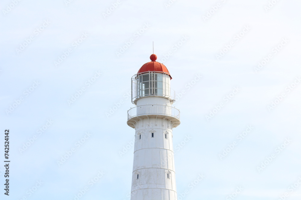 White lighthouse with summer sky