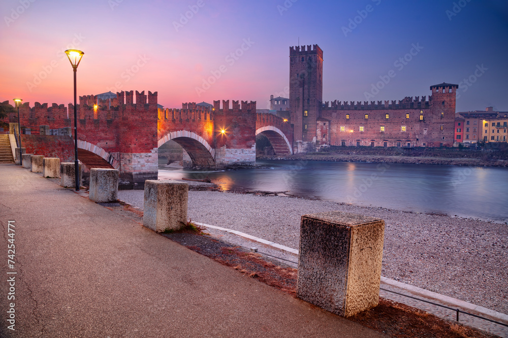 Verona, Italy. Cityscape image of beautiful Italian town Verona with the Castelvecchio Bridge over Adige River at sunrise.