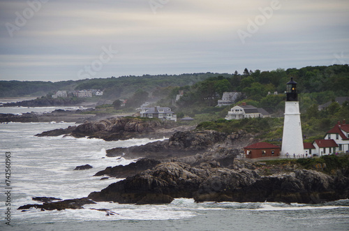 New England lighthouse and seascape ocean landscape nature view in Portland, Maine bay with horizon scenic coastal scenery