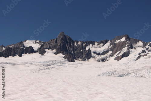Franz Josef Glacier with snowy mountains in New Zealand  © Erika
