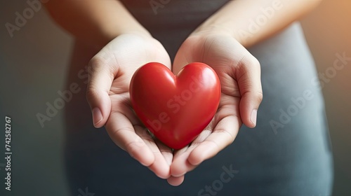 Hand holding red heart  World health day  Health care and mental health concept  Health insurance  Charity volunteer donation  World heart day  Self love  copy space  realistic - generative ai
