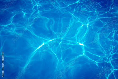 The light reflects blue in the water in the swimming pool. It looks fresh and lively, suitable for use as a wallpaper.