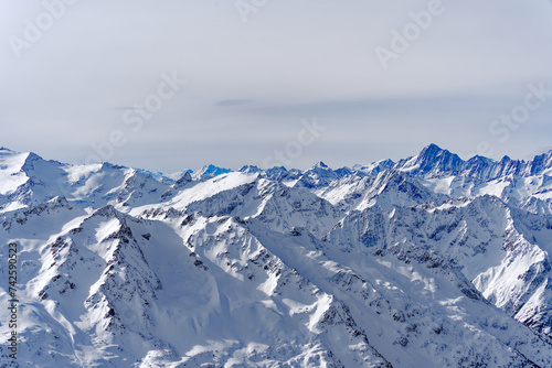 Scenic view of mountain panorama with snow covered mountain peaks in the Swiss Alps at mount Titlis on a sunny winter day. Photo taken February 21st, 2024, Titlis, Engelberg, Switzerland.