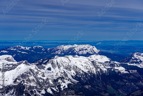 Scenic view of mountain panorama with snow covered mountain peaks in the Swiss Alps at mount Titlis on a sunny winter day. Photo taken February 21st, 2024, Titlis, Engelberg, Switzerland.