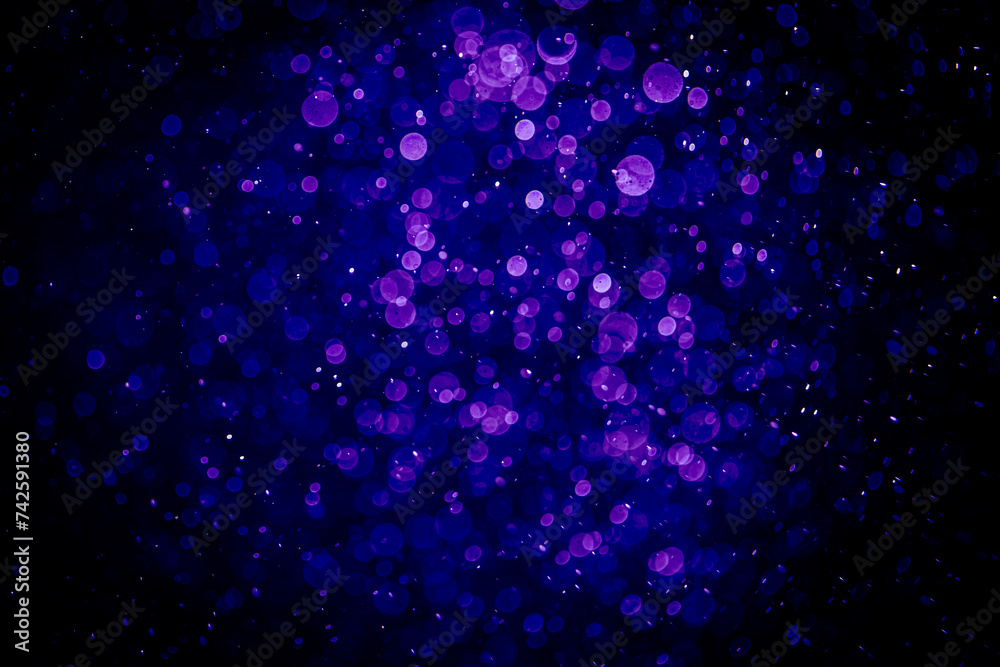 Blurred photo with purple violet and blue dots visible glittering, shining brightly look and feel luxurious Blurred photo with purple violet and blue dots visible glittering, shining brightly look and feel luxurious