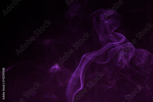 Fototapeta Naklejka Na Ścianę i Meble -  Shapeless purple light on black background used as wallpaper