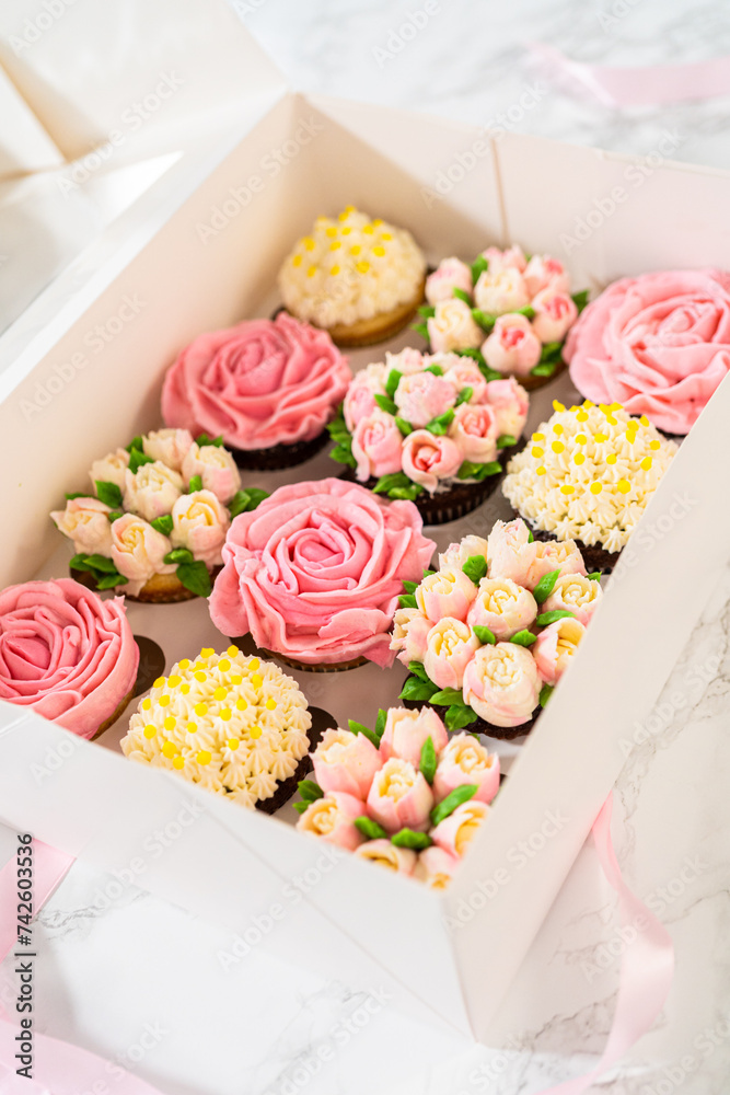 Delicious Gourmet Cupcakes Topped with Buttercream Frosting Flowers Delicious Gourmet Cupcakes Topped with Buttercream Frosting Flowers