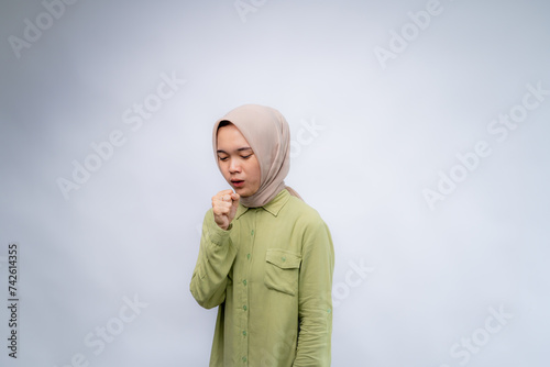 Wallpaper Mural Cough. Portrait Of Young asian woman wearing hijab using his hand to cover his mouth at Copy Space Advertising Your Text, Standing Isolated Over white Studio Background Torontodigital.ca