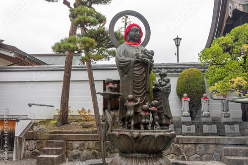 Nagano, Japan. The Enmei Jizo or Nurebutsu, a Buddha statue in the temple of Zenko-ji photo