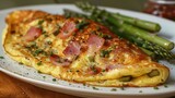 a ham and asparagus omelette, filled with diced ham, asparagus spears, and Swiss cheese
