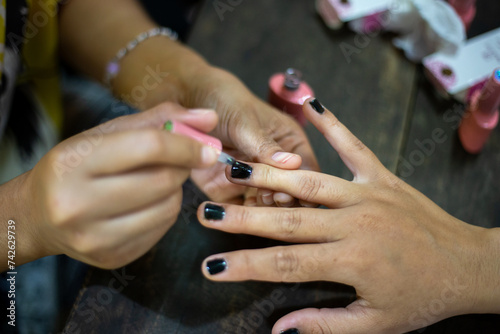 Select focus Asian women s nails I m decorating my fingernails at home.