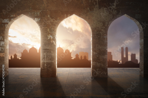 Arched mosque window with a view of a silhouette of the mosque with a dramatic sky view