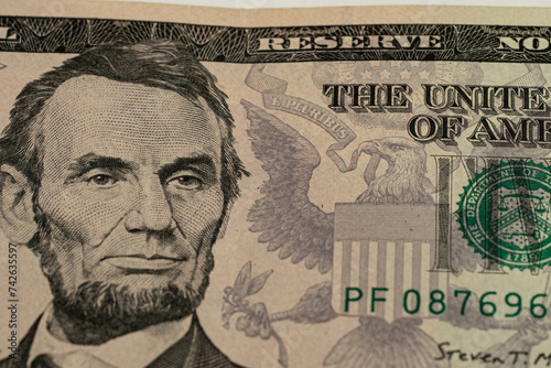 US President Abraham Abe Lincoln on USA five dollar bill extreme macro, 5 usd, United States of America money closeup photo