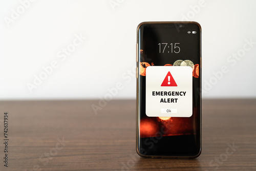 Emergency alert notification on mobile phone photo