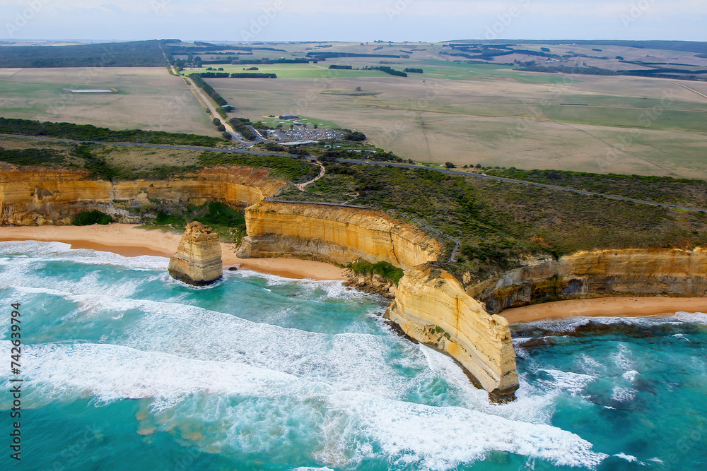 Fototapeta premium Aerial view of the Australian coastline at the Twelve Apostles in the Port Campbell National Park - Collection of limestone stacks in the Tasman Sea off the coast of Victoria, Australia