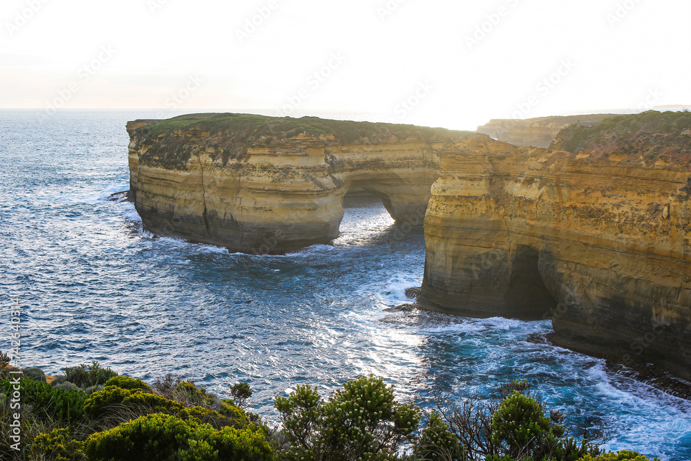 Fototapeta premium Offshore natural arch of Mutton Bird Island seen from the Loch Ard Gorge in the Twelve Apostles Marine National Park along the Great Ocean Road in Victoria, Australia