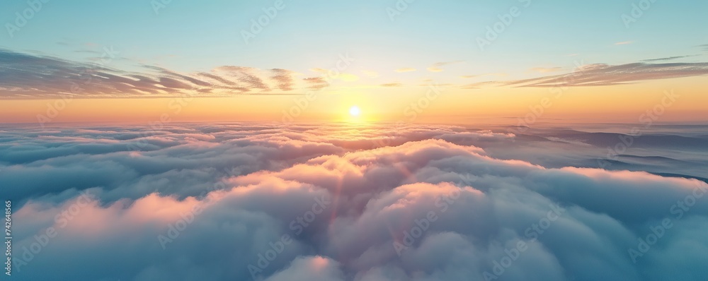 view of the clouds above the sky during a bright sunset.