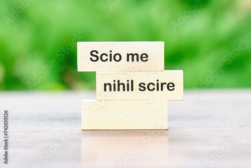 Scio me nihil scire It is translated from Latin as I know I don't know anything. written on wooden blocks photo