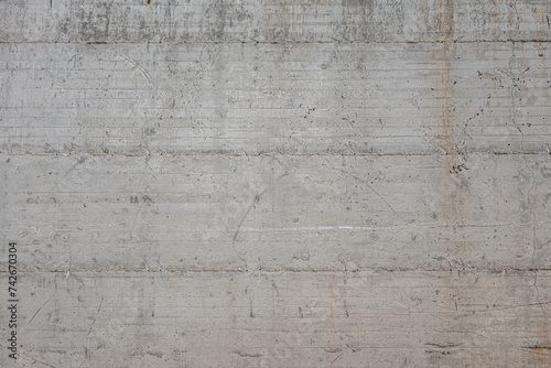 abstract background concrete wall texture with traces of wooden formwork photo